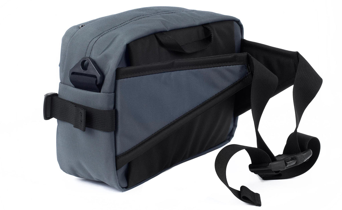 detail visible^^A 3/4 shot of the Le Grand Derriere showing the side and rear of the pack with its hip belts out and connected.