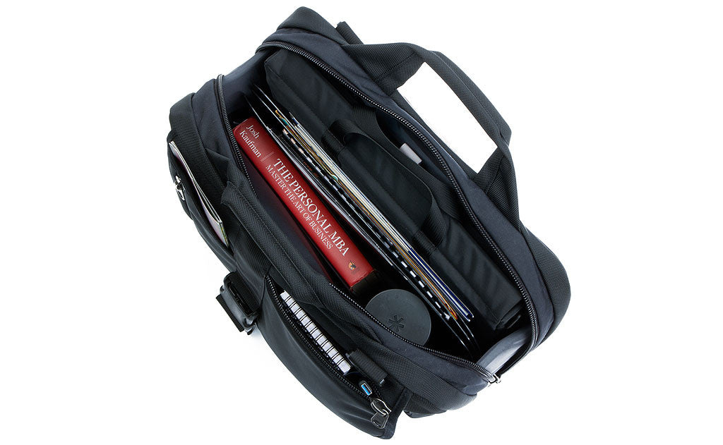 detail visible^^A filled Empire Builder main compartment with a laptop case, book, water bottle, and files