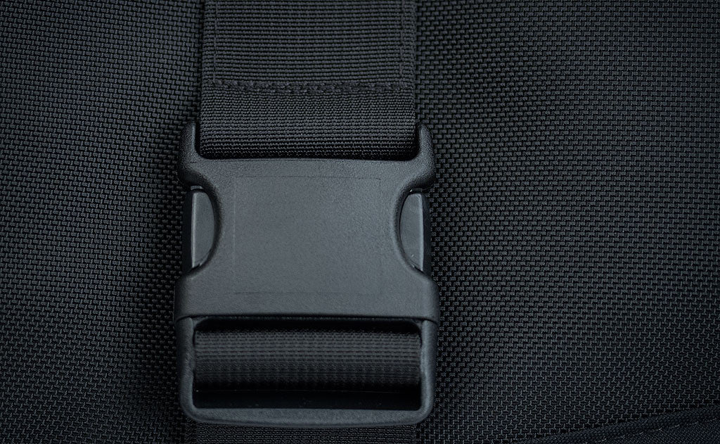detail visible^^Close shot of the front flip-top compartment's buckle