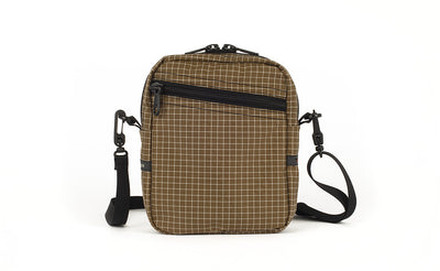 visible variant TB0416-CDNE TB0416-CDLE^^An Everyday Cubelet in Coyote Halcyon (brown with a white grid) with a front zipper.