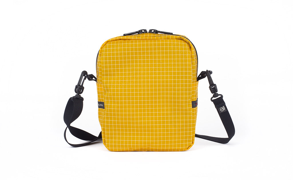 visible variant TB0416-ODNE TB0416-ODLE^^A back view of the Everyday Cubelet in Solaris Halcyon (yellow with a white grid) showing a completely fabric back.
