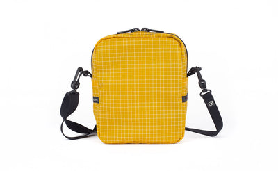 visible variant TB0416-ODNE TB0416-ODLE^^A back view of the Everyday Cubelet in Solaris Halcyon (yellow with a white grid) showing a completely fabric back.