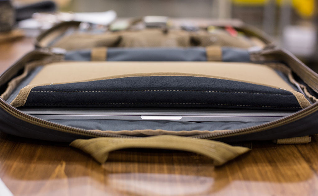 A laptop in the padded laptop pocket of the Founder's Briefcase.