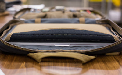 A laptop in the padded laptop pocket of the Founder's Briefcase.