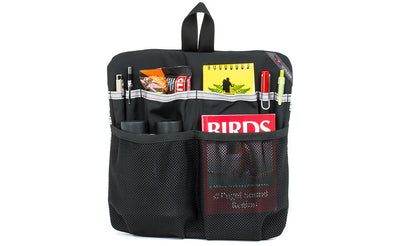 visible variant TB1835-BN^^ The Large Café Bag Freudian Slip, holding four pens, a protein bar, small binoculars and a field guide.