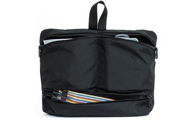 visible variant TB1836-BJ^^ The Black Maker's Bag / Swift Freudian Slip holding knitting needles and other knitting tools.