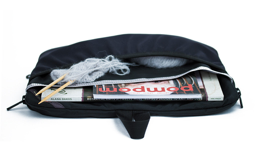 visible variant TB1836-BJ^^ The Black Maker's Bag / Swift Freudian Slip laying flat, holding magazines and a ball of yarn.