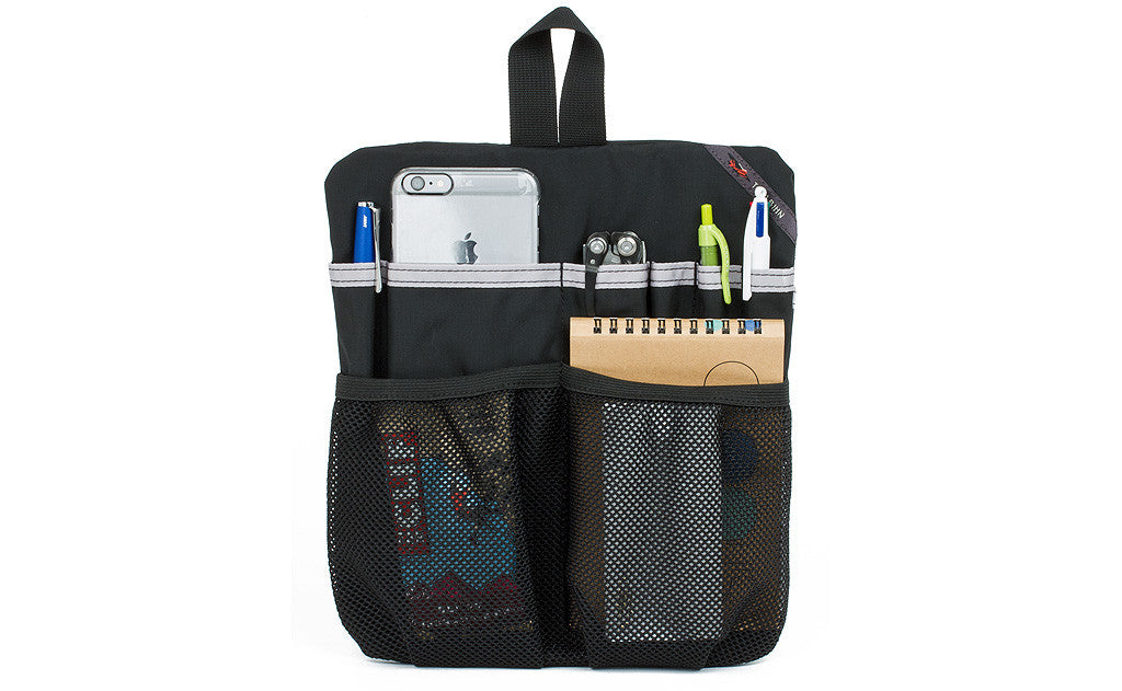 visible variant TB1834-BJ^^ A Black Medium Cafe Bag Freudian Slip, holding a small notebook, pens, multi-tool, and a phone.