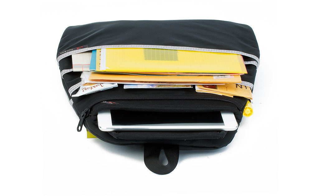 visible variant TB1843-BJ^^ The back of the Black Synapse 25 Freudian Slip, holding file folders, small notebooks, and a small tablet.