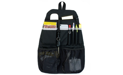 visible variant TB1843-BJ ^^ A Black Synapse 25 Freudian Slip holding pends, a small notepad, a wireless mouse, pens, cables, and charger.