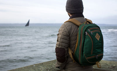 lifestyle visible^^A person on a beach wearing the Guide's Edition Synik 22.