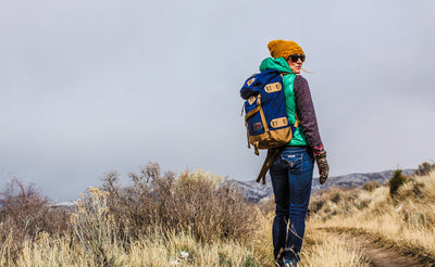 lifestyle visible^^A person on a prairie trail with the Guide's Pack.