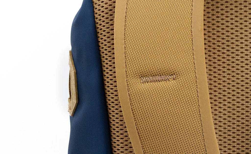 detail visible^^A close shot of the bartacking on the shoulder strap on the Guide's Pack.