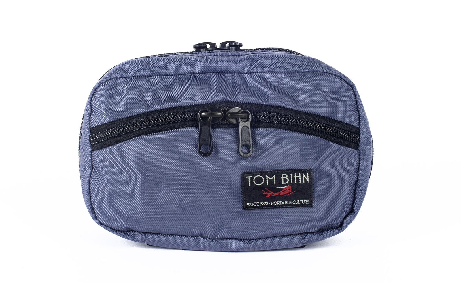 visible variant TB0418-DJ^^The front of a Handy Little Thing #1 in Dawn (purple/grey) 210 Ballistic showing the front zipper with two slider and logo at the bottom-right corner.