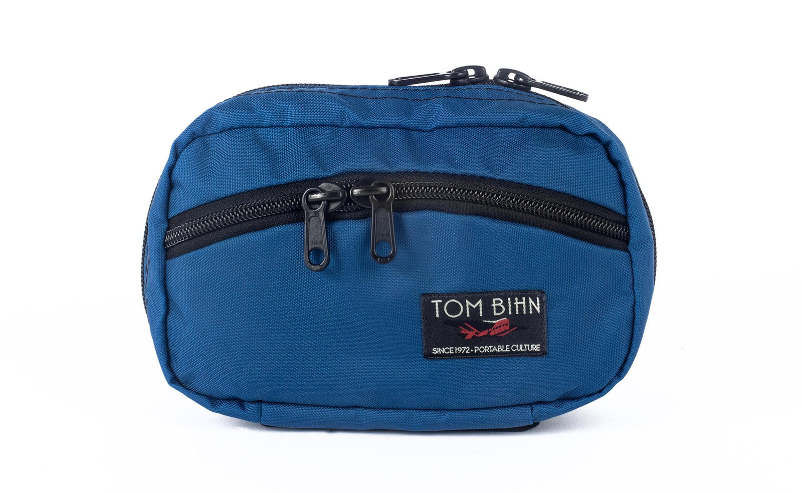 visible variant TB0418-IJ^^The front of a Handy Little Thing #1 in Island (blue) 210 Ballistic showing the front zipper with two slider and logo at the bottom-right corner.