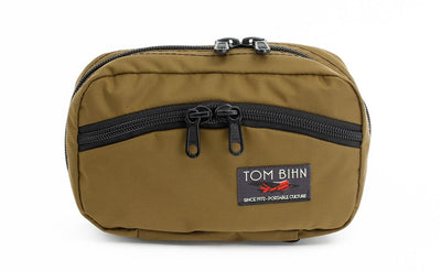 visible variant TB0418-CJ^^The front of a Handy Little Thing #1 in Coyote (tan) 210 Ballistic showing the front zipper with two slider and logo at the bottom-right corner.