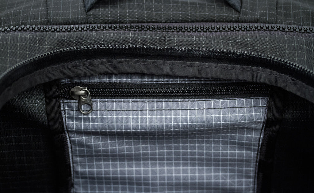 visible variant TB0907-BHND^^A close shot of the small interior zippered pocket on the Top Pocket.