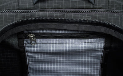 visible variant TB0907-BHND^^A close shot of the small interior zippered pocket on the Top Pocket.