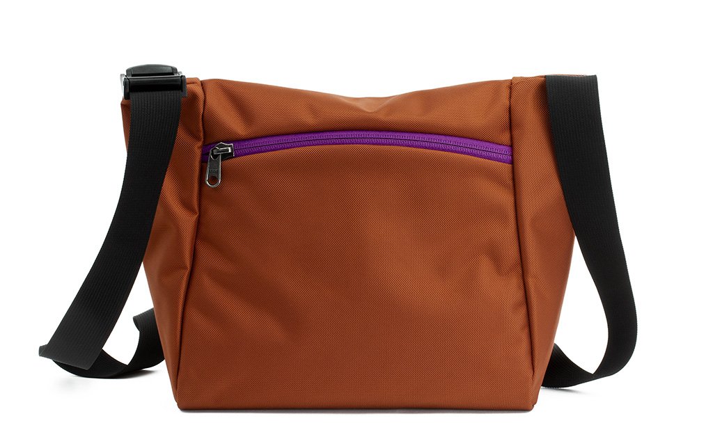 visible variant TB1415-TKUZ^^Reverse shot of an Icon in Burnt Orange 525 Ballistic with Ultraviolet (purple) zippers.