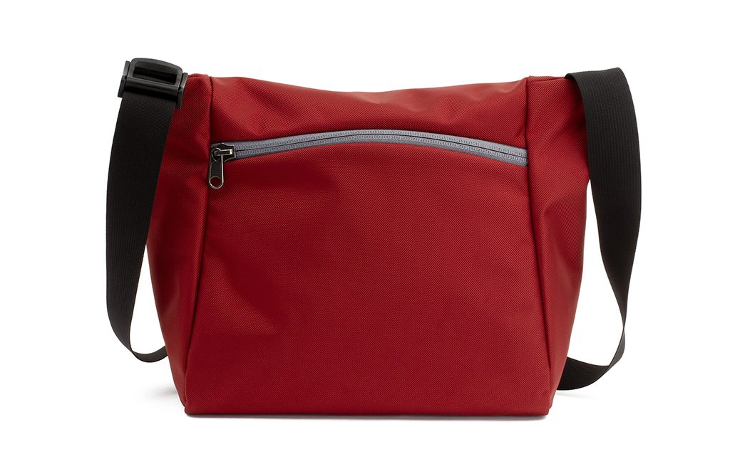 visible variant TB1415-MKNZ^^Reverse shot of an Icon in Mars Red 525 Ballistic with Northwest Sky (light grey) zippers.