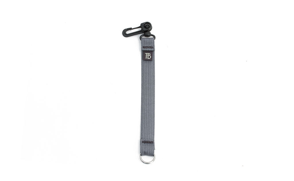 visible variant TB0515S-NA^^An 8-inch Northwest Sky (light grey) Key Strap with a snaphook at one end and a split-ring o-ring at the other.