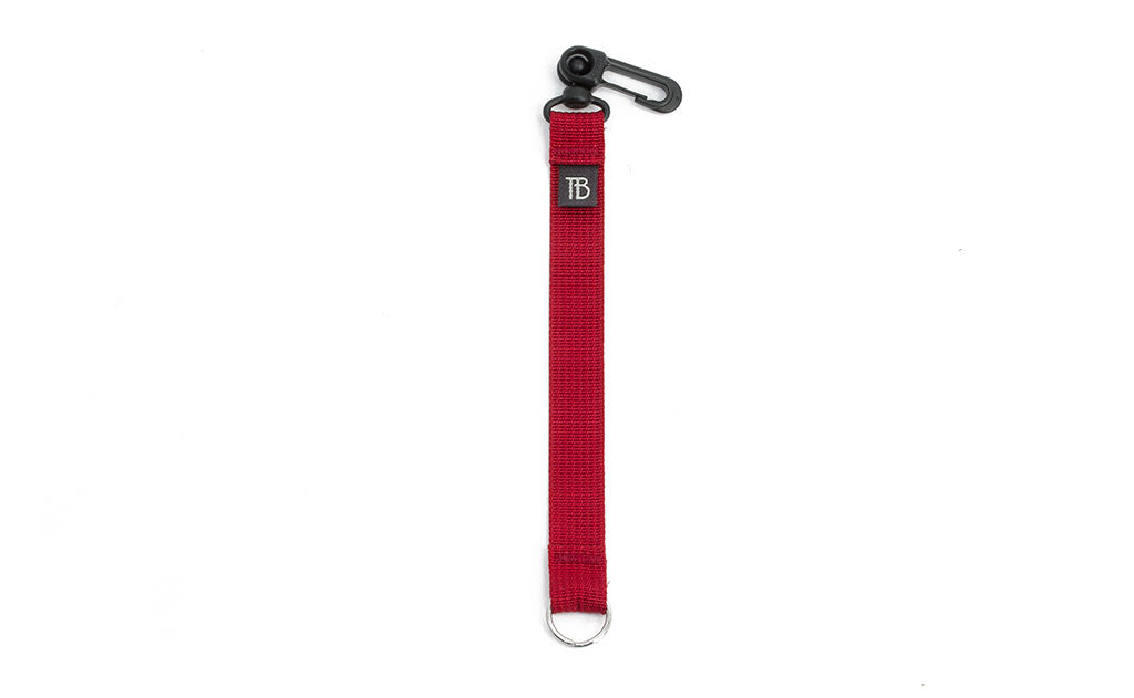 visible variant TB0515S-IA^^An 8-inch Iberian (red) Key Strap with a snaphook at one end and a split-ring o-ring at the other.