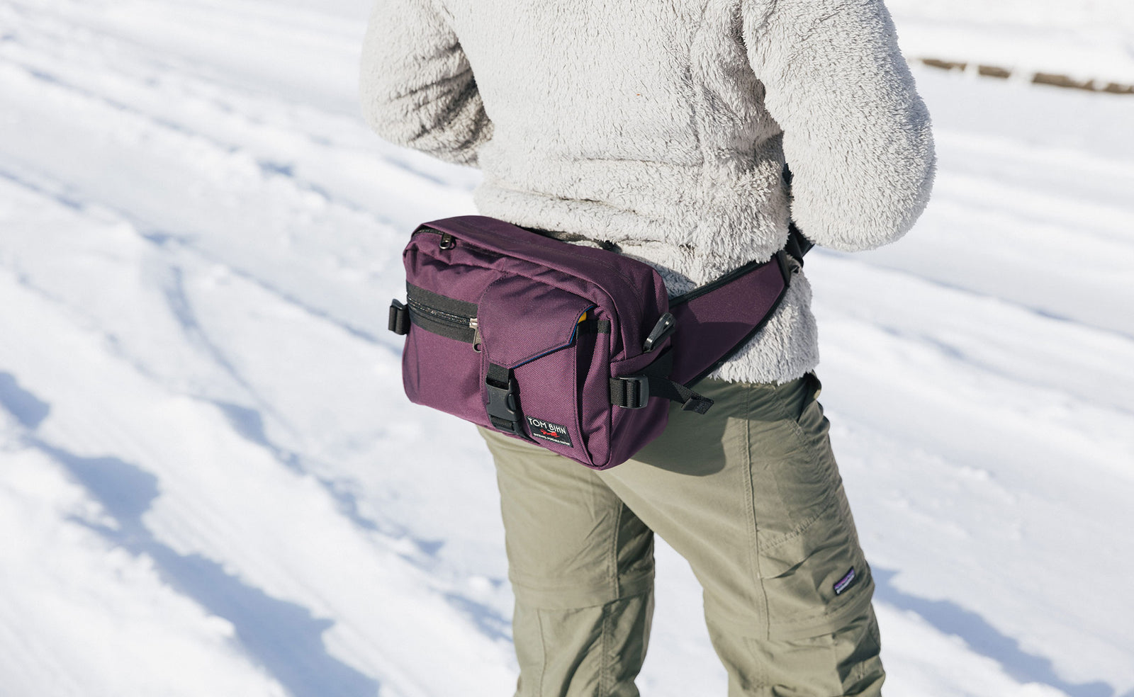 lifestyle visible^^Person wearing the LPD in Aubergine as a waist pack.