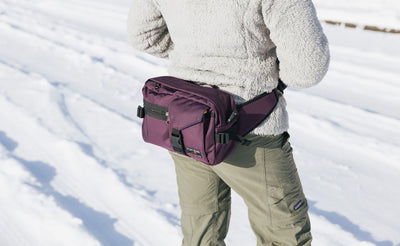 lifestyle visible^^Person wearing the LPD in Aubergine as a waist pack.