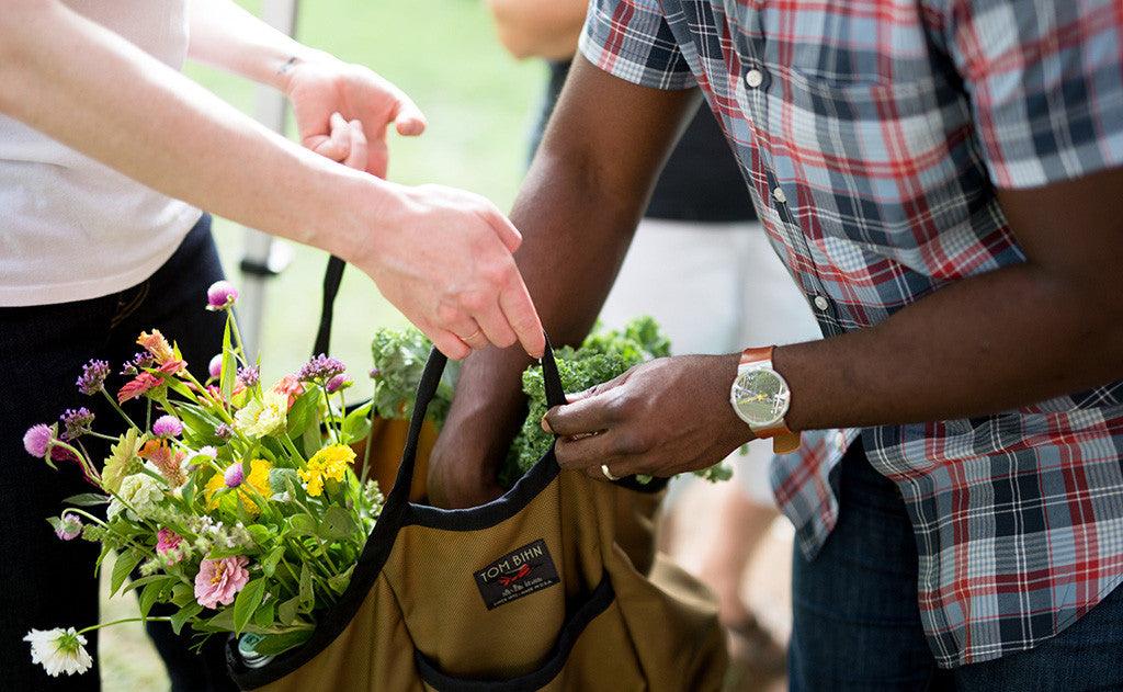 lifestyle visible^^A person placing an item in a Moveable Feast.