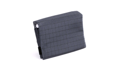 visible variant TB1275-TH TB1277-TH^^The Size 5 Nik's Minimalist Wallet in Night Walk (dark blue with grey grid) 400 Halcyon closed with the attached elastic band.