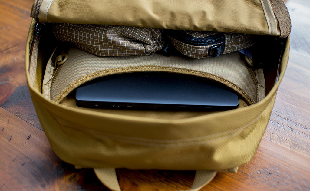 detail visible^^Guide's Edition Paragon with a Pinebook Pro in the laptop pocket.