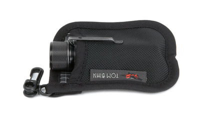 detail visible^^A Pocket Pouch holding a pocket flashlight.