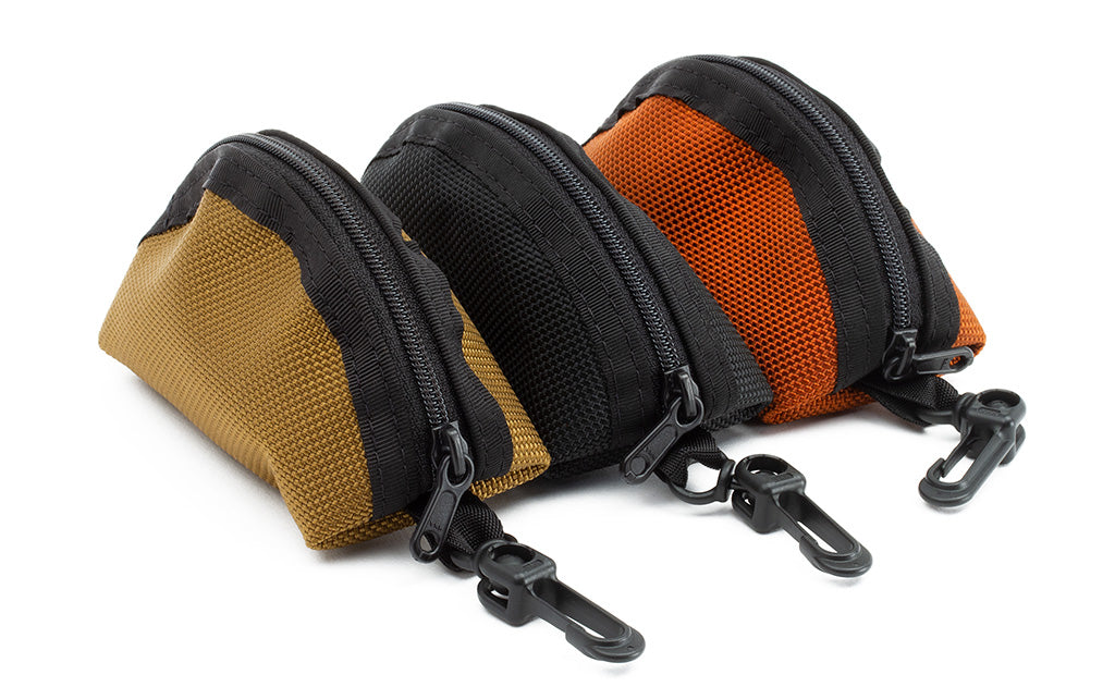 detail visible^^Mini Q-Kits in Burnt Orange 1050 Ballistic, Black 1050 Ballistic, and Coyote (tan) 1050 Ballistic