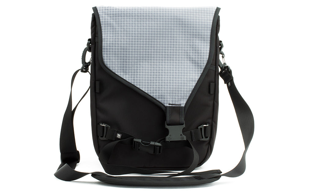 visible variant TB0243-BKND^^The Ristretto in Black 525 Ballistic with Northwest Sky (light grey with white grid) 200 Halcyon interior.