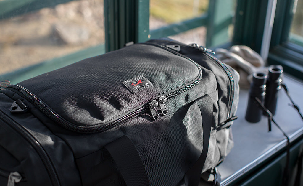 lifestyle visible^^A Road Buddy Duffel in a fire lookout tower.