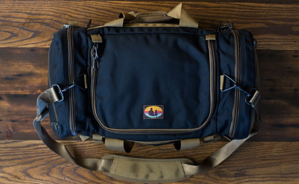 visible variant SD5412-BBCN^^The Medium Skookum Dog Road Duffel in Black 1050 Ballistic.