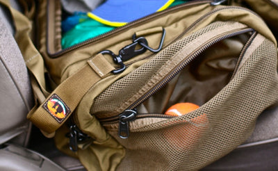 lifestyle visible^^A close shot of the mesh side pocket on the Medium Road Duffel.