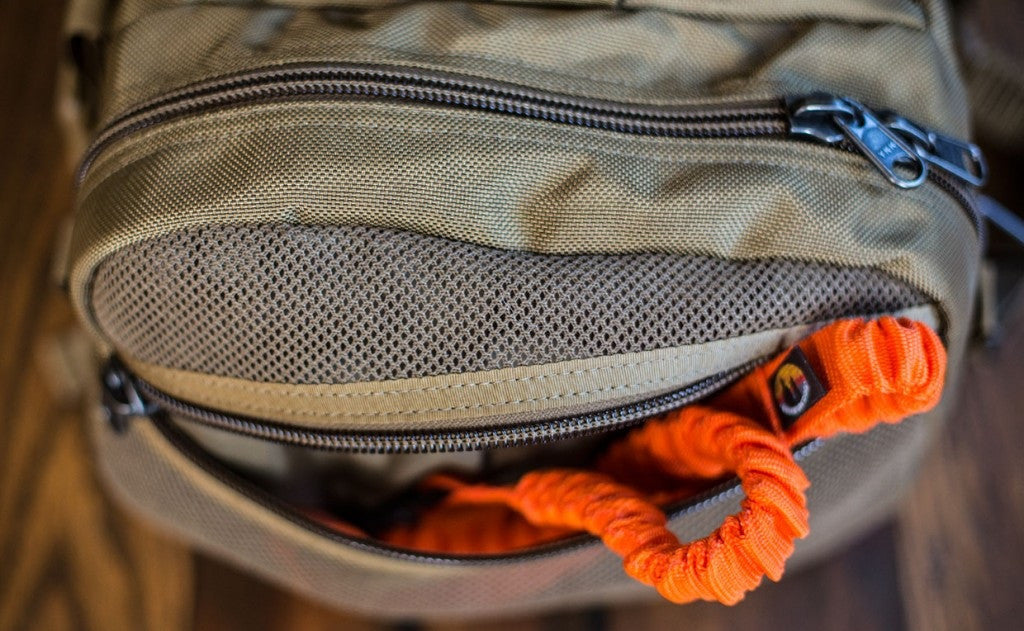lifestyle visible^^A close shot of the mesh side pocket on the Medium Road Duffel.