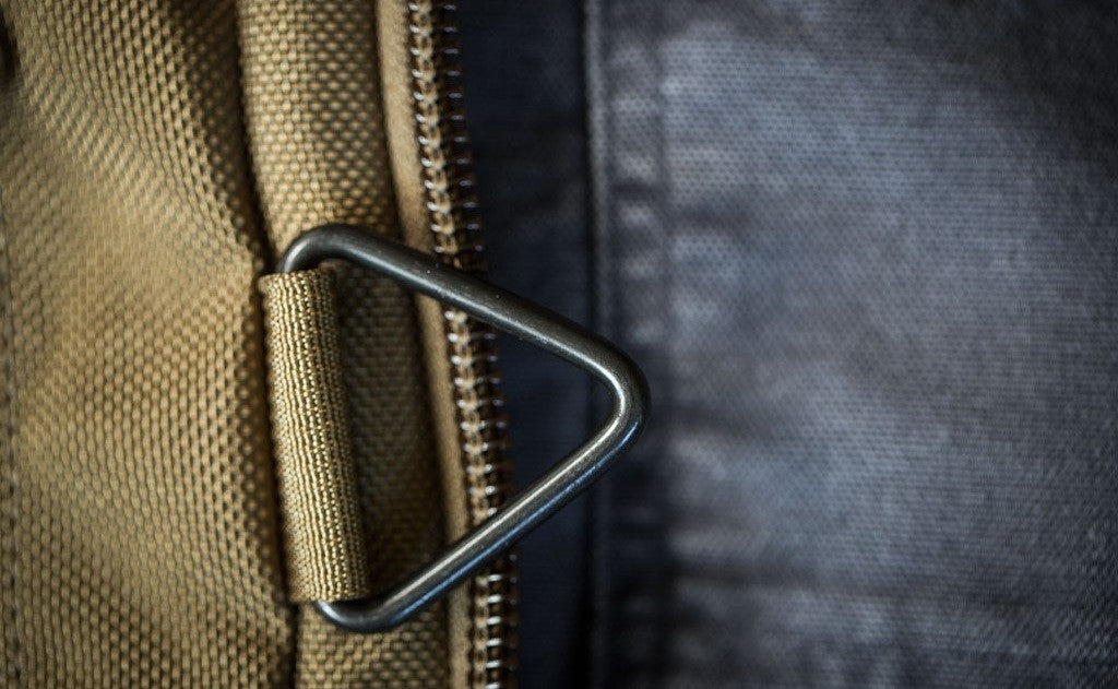 detail visible^^A close shot of the metal triangle strap attachment point.