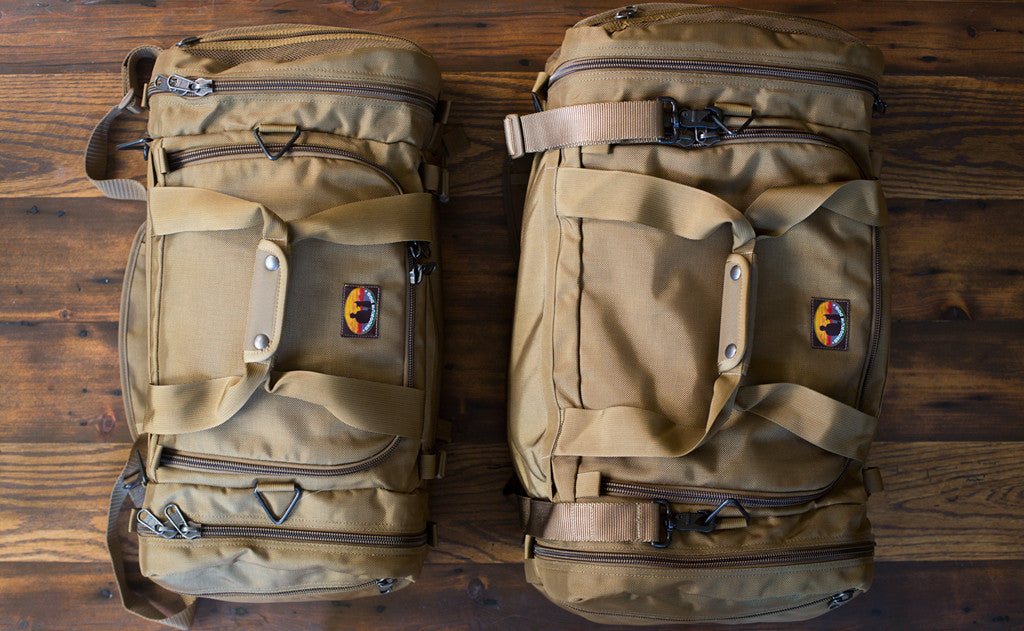 detail visible^^The Medium and Large Skookum Dog Road Duffel side-by-side.