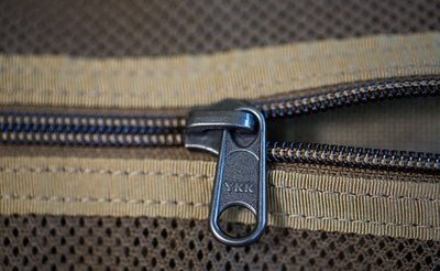 detail visible^^A close shot of a zipper on the Large Road Duffel.