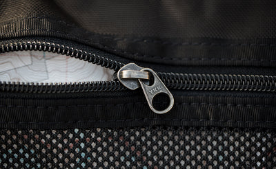 detail visible^^Close shot of the zipper for a mesh pocket on the top flap of an Original Shadow Guide 31.