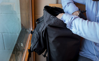 lifestyle visible^^A person accessing the main compartment of the Original Shadow Guide 31.