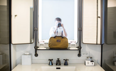 visible lifestyle^^The Standard Spiff Kit on a shelf in a hotel restroom.