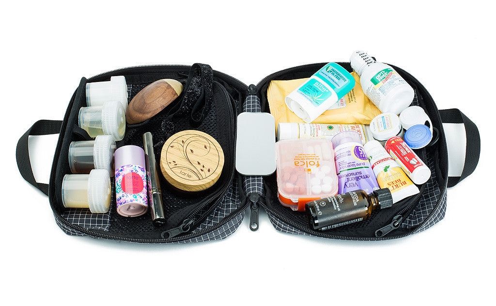 visible detail^^The Deluxe Spiff Kit covered in the items that could fill it completely, including several creams, travel wipes, travel deodorant, eyedrops, makeup, and more.