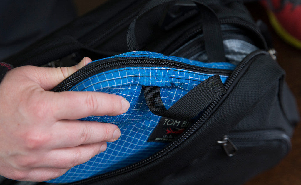 visible lifestyle^^A person removing the Spiff Kit from the pocket of an Aeronaut.
