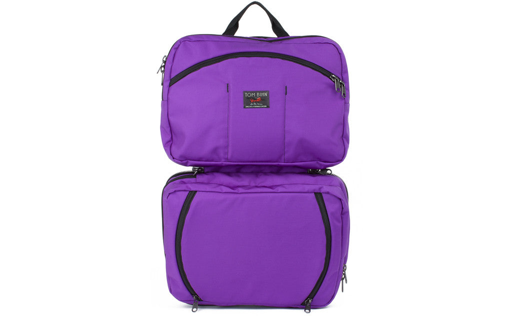 visible variant TB0975-AKDJ^^The Stowaway in Alphaviolet (bright purple) 525 Ballistic with the center compartment opened.