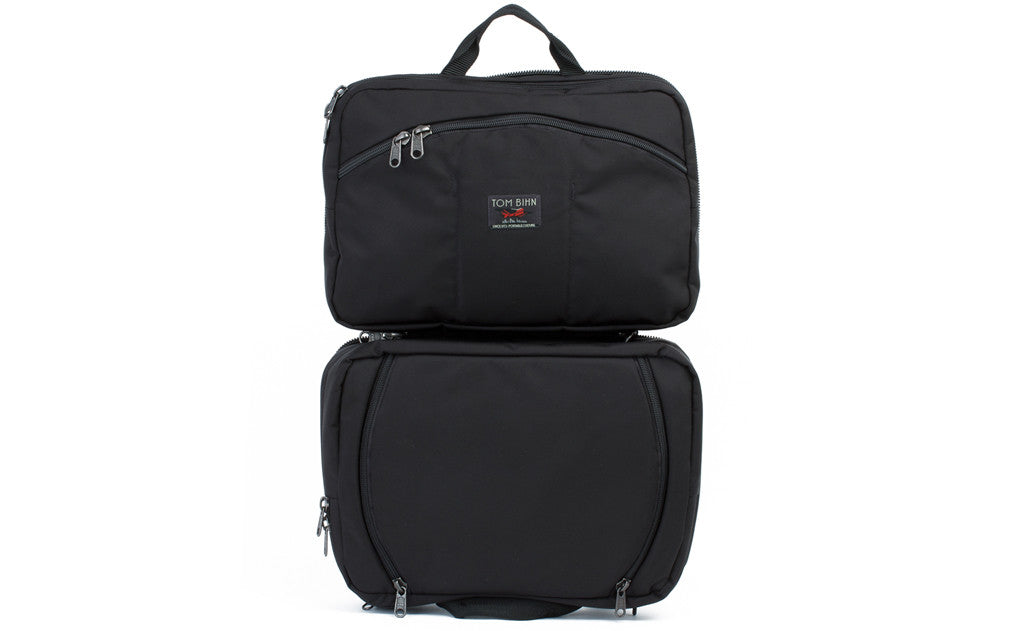 visible variant TB0975-BKLJ^^A shot of the face of The Stowaway in Black 525 Ballistic with its main compartmant opened.