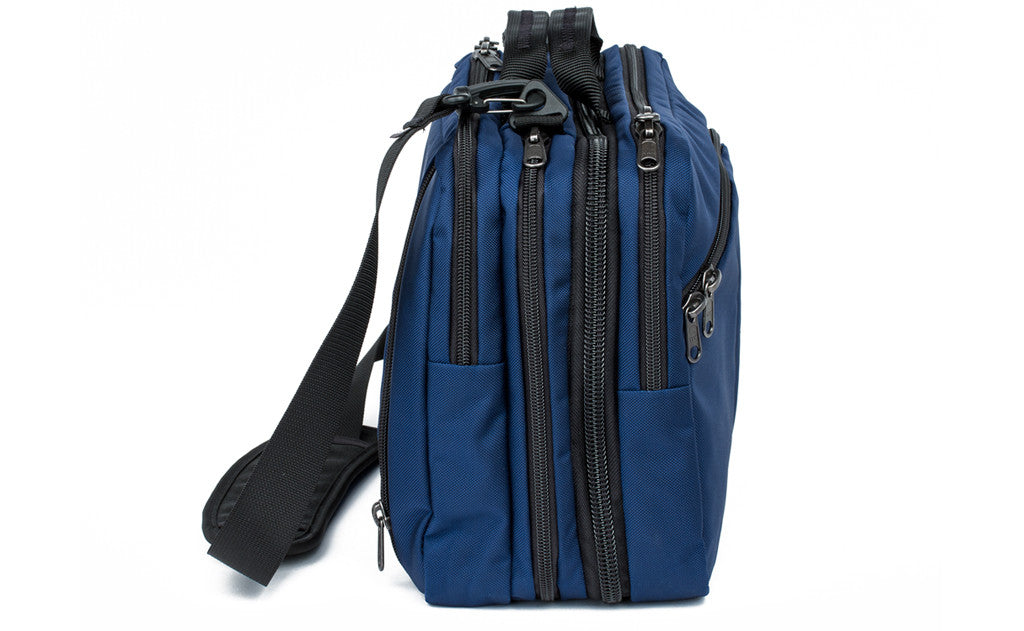 visible variant TB0975-DKGJ^^A side-on shot of The Stowaway in Deep Blue (dark blue) 525 Ballistic.