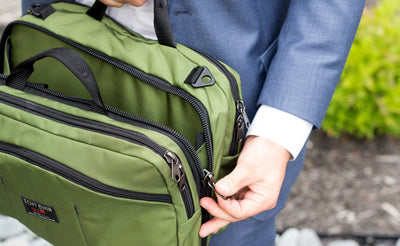 lifestyle visible^^A person opening the center compartment of The Stowaway.